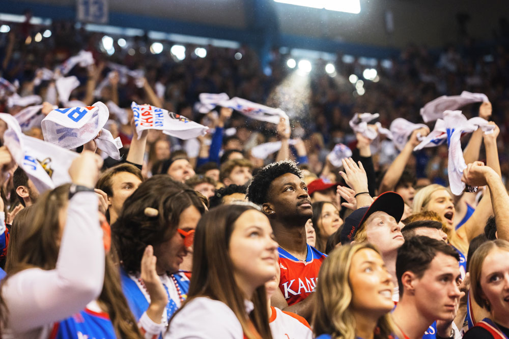 Students cheer and wave towels during a KU men's basketball game at Allen Fieldhouse.