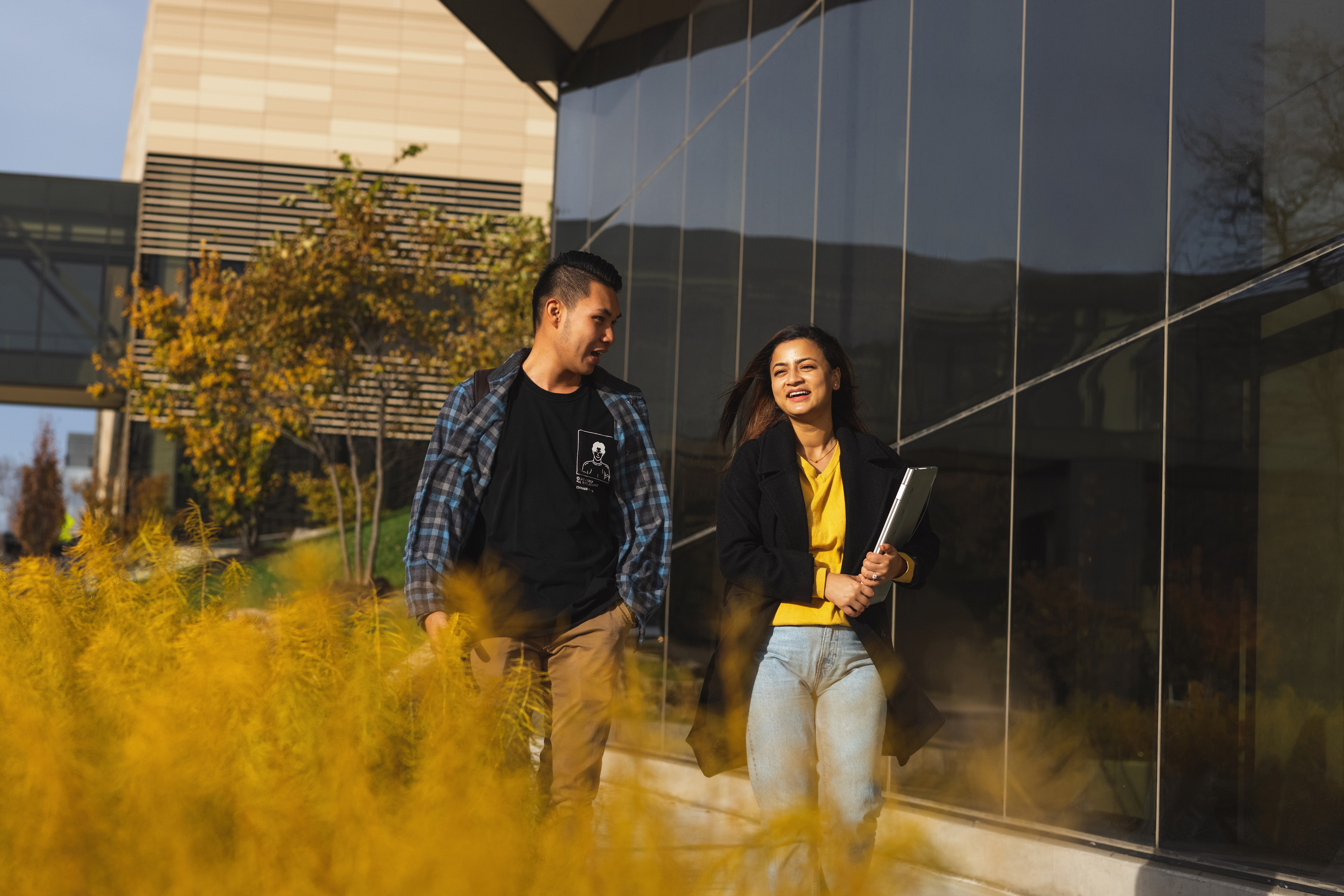 Students walking next to Ritchie Hall on the Lawrence campus